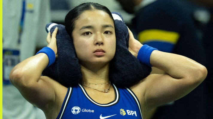 Pictured: Alexandra Eala takes a breather during a match