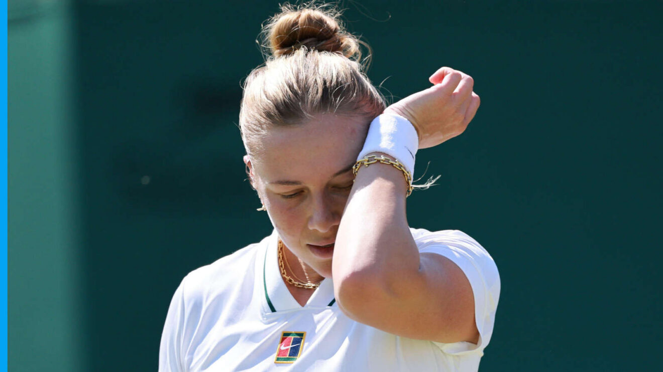 Pictured: Amanda Anisimova wipes her face during a match