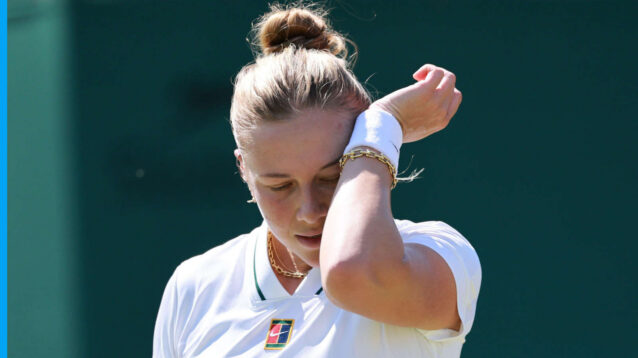 Pictured: Amanda Anisimova wipes her face during a match