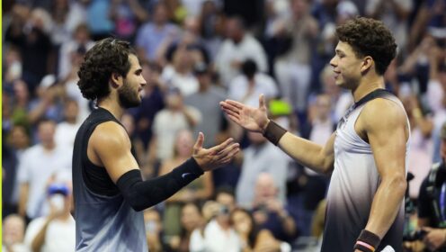 Ben Shelton and Carlos Alcaraz embracing at the net at the 2026 US Open.