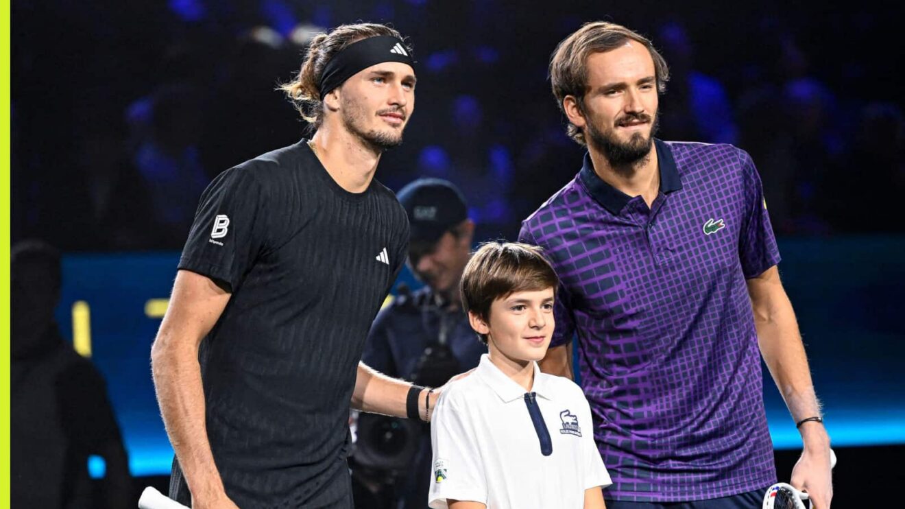 Pictured: Alexander Zverev and Daniil Medvedev with a mascot