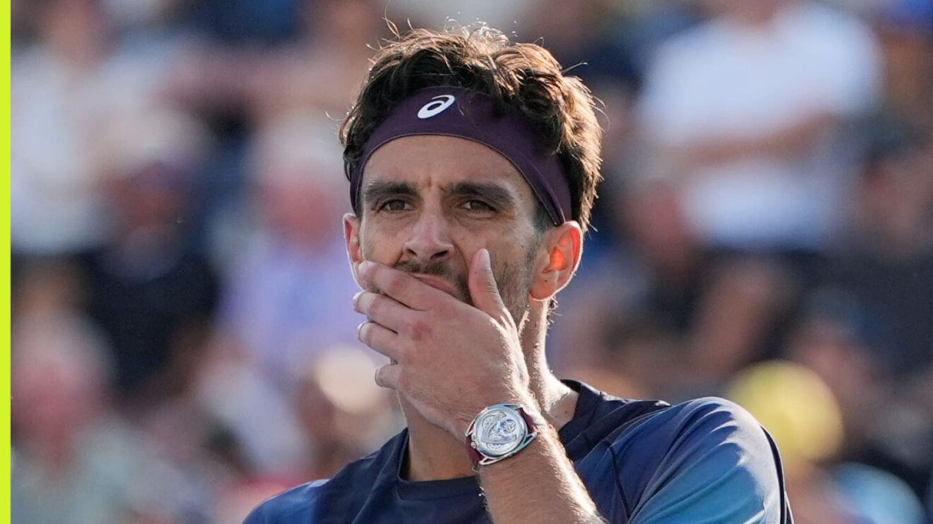 Pictured: Lorenzo Musetti puts his hand to his face