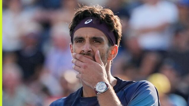 Pictured: Lorenzo Musetti puts his hand to his face