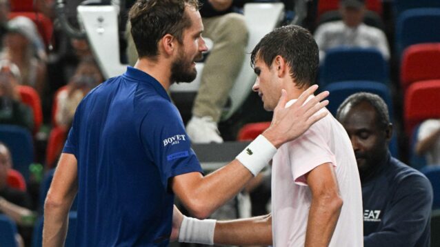 Daniil Medvedev and Rafael Jodar shaking hands at the net at the Shanghai Masters 2026.